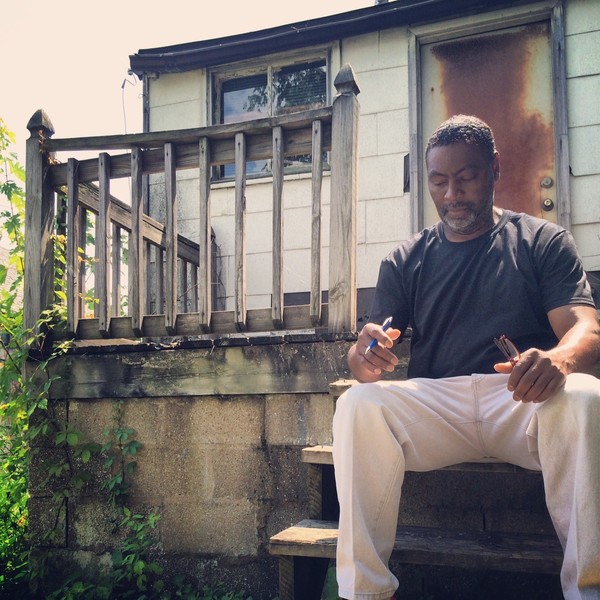 In this town next to Ferguson, houses are run down, and many are vacated. This is due to a host of new permits the Mayor has imposed for any resident to maintain the well-being of the home. To paint a home a permit is needed, to clean out the raingutters a permit is needed. People can't afford the permits, so the homes are left to waste. Here, a local organizer shows a typical "porch."