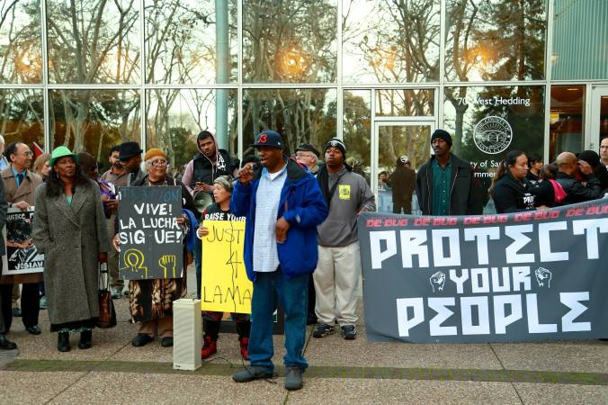 Lamar Noble, wrongfully arrested for a resisting arrest charge, addresses the crowd at the start of the Protect Your People March.